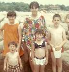That's me in the flowered poncho.  The baby brother is the adorable little curly haired guy to my right.  Weren't we cute?